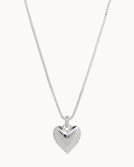 TRUE Solid or Plated Show off your style with this stylish Demi-Fine necklace. Made of 14K plated gold, the design features a Ridged Puffy Heart Pendant - Silver. 