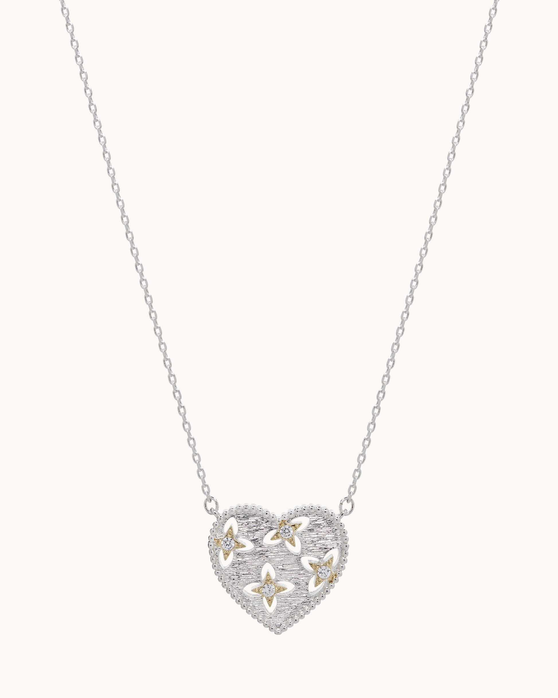 TRUE Solid or Plated Add a unique piece to your wardrobe with this stylish Demi-Fine necklace. Made of 14K plated gold, the design features a Brushed Heart Pendant - Two Tone Silver. 