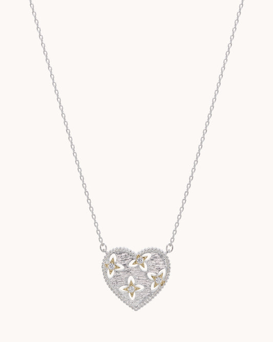 TRUE Solid or Plated Add a unique piece to your wardrobe with this stylish Demi-Fine necklace. Made of 14K plated gold, the design features a Brushed Heart Pendant - Two Tone Silver. 
