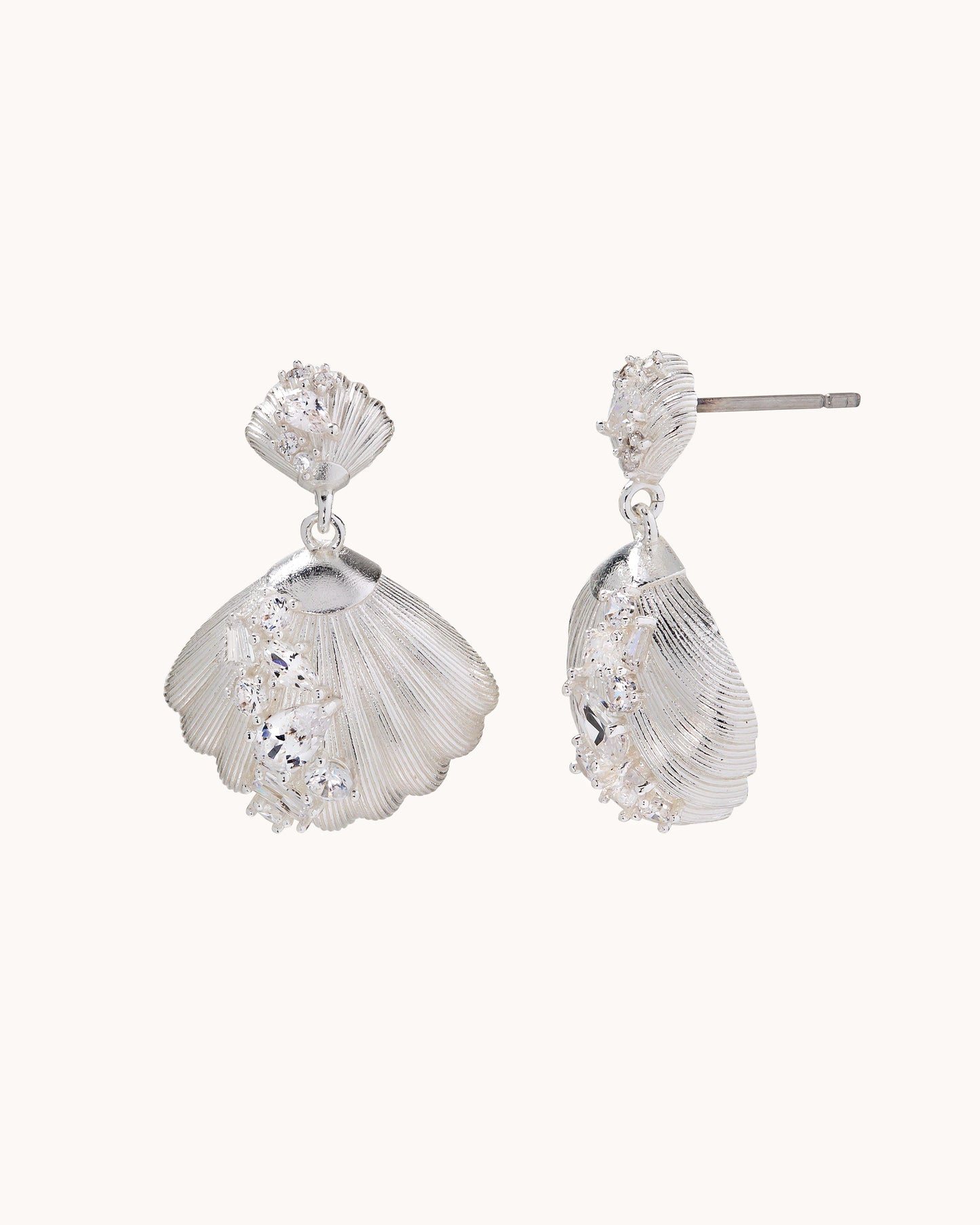 TRUE Solid or Plated Make a fashion statement with these Demi-Fine earrings. Made of 14K plated gold, the design features a Brushed Shell Drop Ear - Silver. 